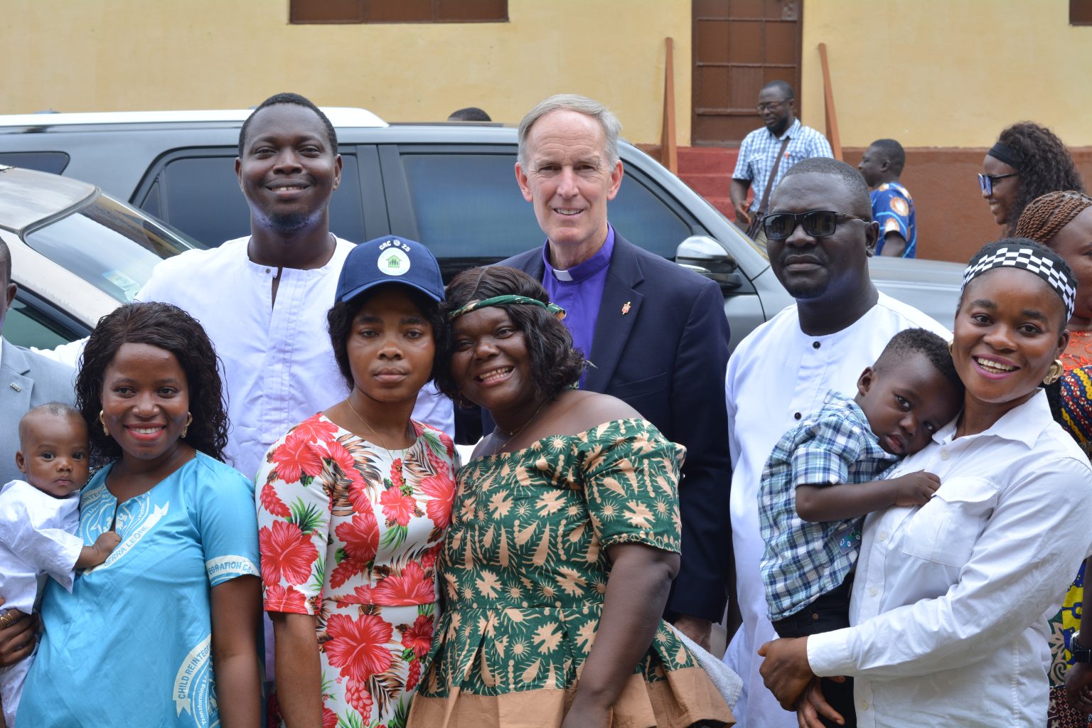 Bishop. Tom Berlin with a cross- section of the Alumni